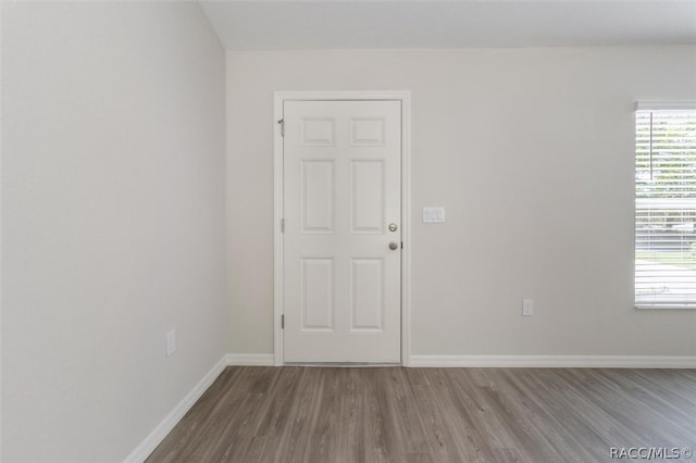 unfurnished room with light hardwood / wood-style floors