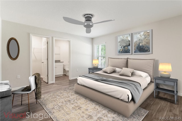 bedroom with a walk in closet, ceiling fan, hardwood / wood-style floors, connected bathroom, and a closet