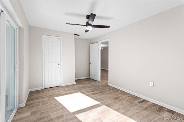 unfurnished bedroom featuring ceiling fan