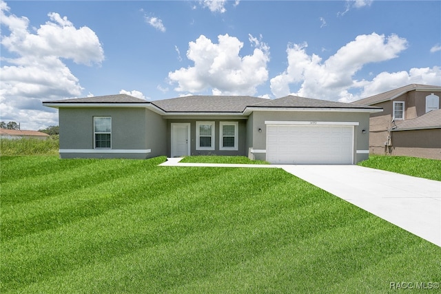 view of front of house featuring a garage and a front yard