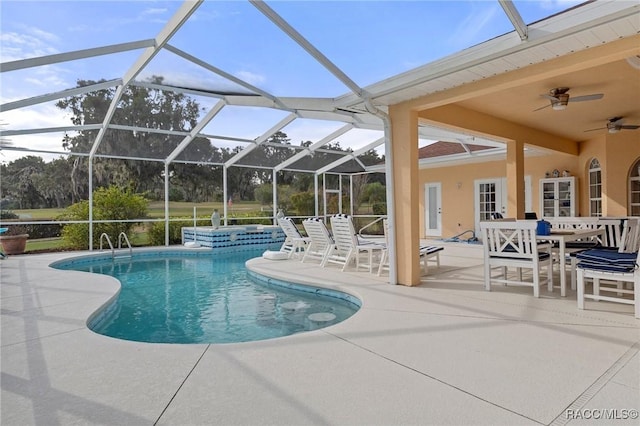 pool featuring ceiling fan, outdoor dining space, a patio area, and a lanai