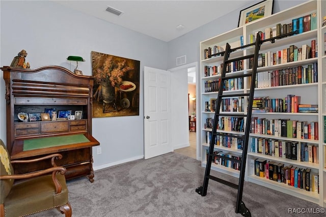 sitting room with baseboards, visible vents, and light colored carpet