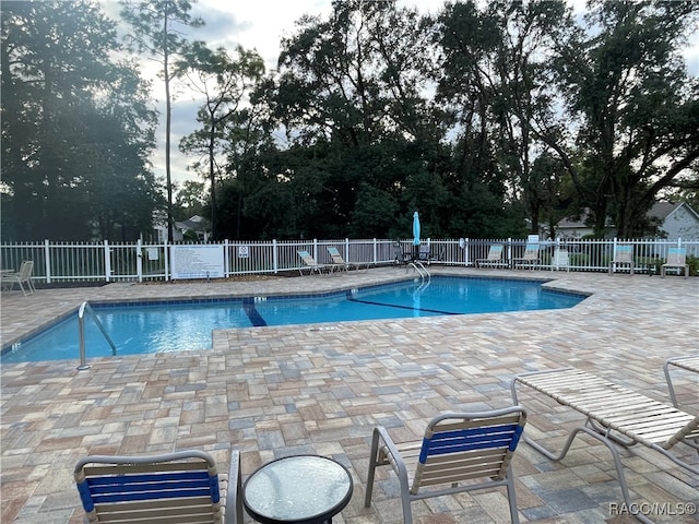 view of pool with a patio