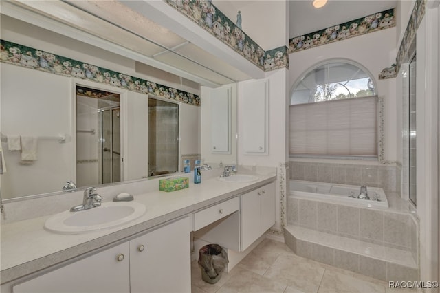 bathroom featuring tile patterned floors, vanity, and separate shower and tub