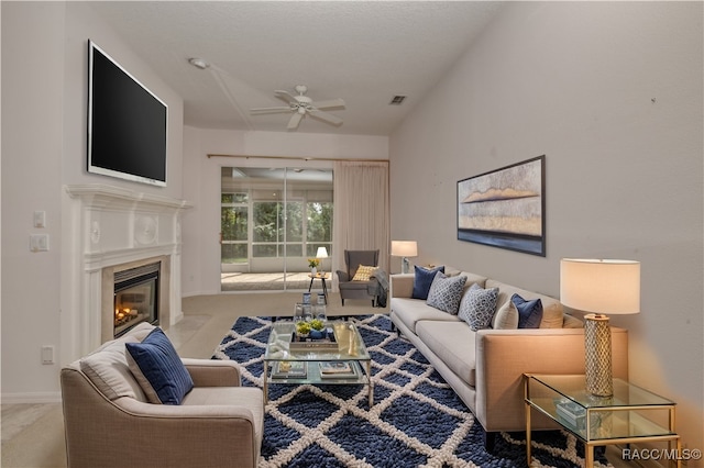 living room with ceiling fan and light carpet