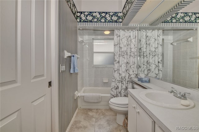 full bathroom featuring tile patterned floors, vanity, toilet, and shower / bathtub combination with curtain