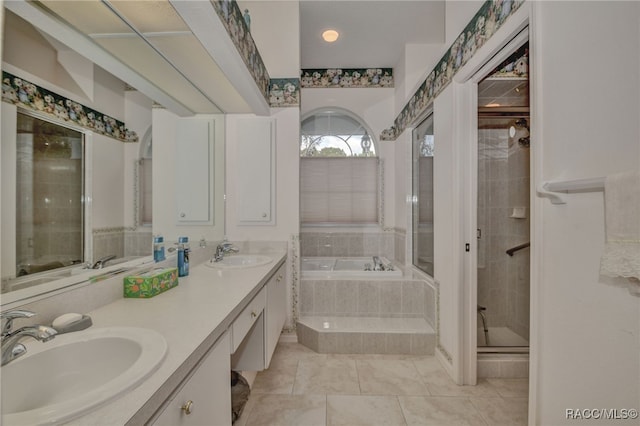 bathroom with tile patterned flooring, vanity, and independent shower and bath