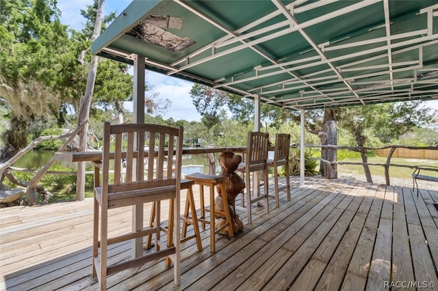 wooden deck featuring a water view