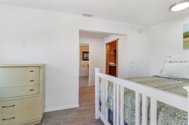 bedroom featuring wood-type flooring