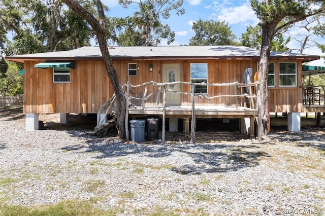 rear view of house with a wooden deck