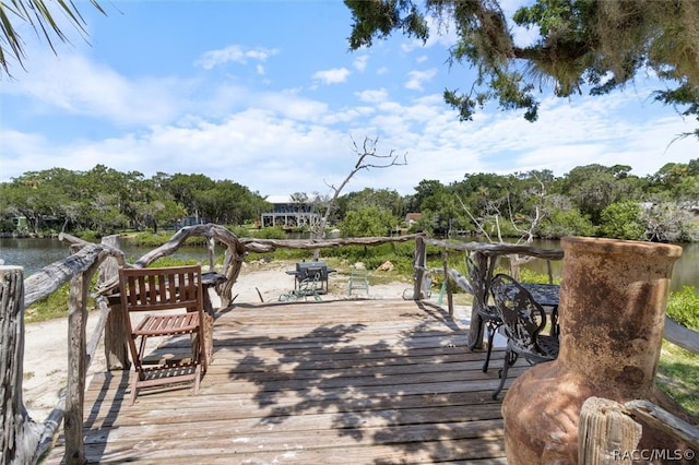 wooden terrace with a water view