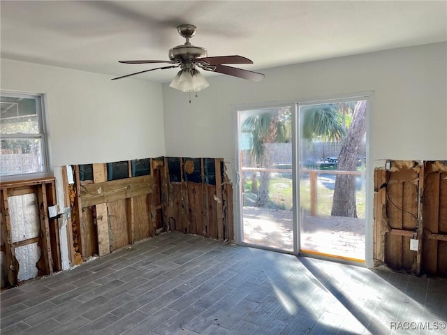 interior space featuring dark hardwood / wood-style floors and ceiling fan