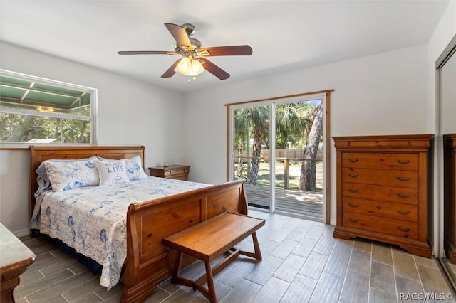 bedroom featuring hardwood / wood-style floors, ceiling fan, and access to exterior