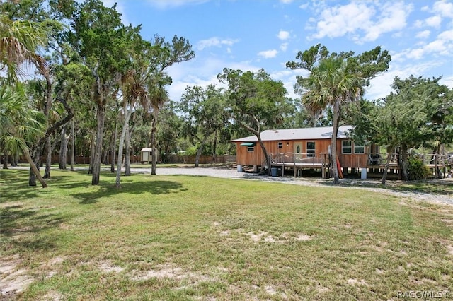 view of yard with a wooden deck