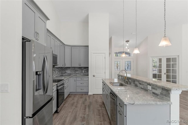 kitchen featuring a sink, french doors, gray cabinets, and stainless steel appliances