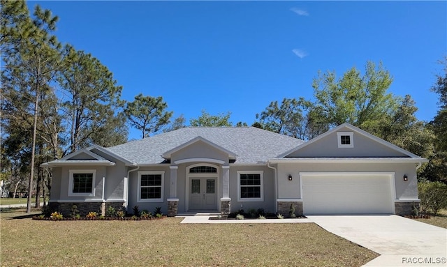 view of front facade featuring stucco siding, driveway, a front lawn, stone siding, and an attached garage