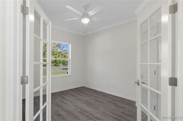 unfurnished room with baseboards, ornamental molding, french doors, a ceiling fan, and wood finished floors