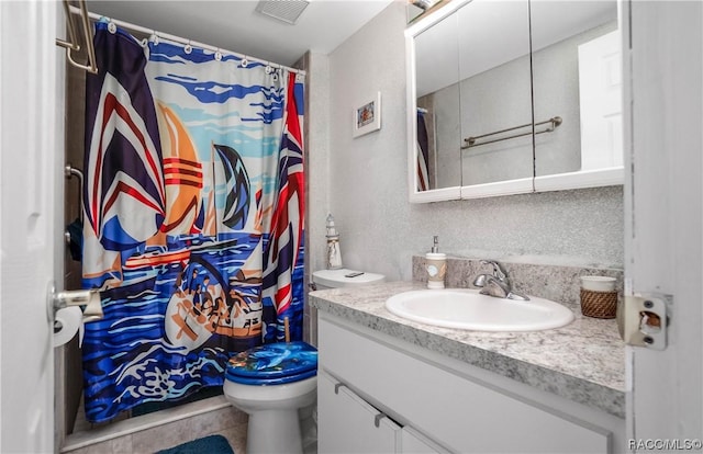 2400 Forest Dr Unit 103, Inverness, FL 34453 - bathroom with vanity, toilet, and a shower with shower curtain