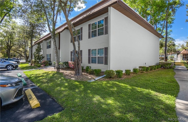 view of home's exterior featuring a lawn