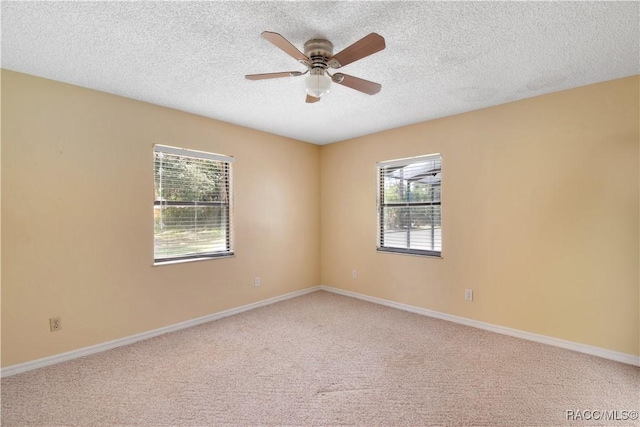 3231 S Eagle Pt, Inverness, FL 34450 - carpeted spare room with plenty of natural light, a ceiling fan, and a textured ceiling