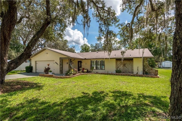 3231 S Eagle Pt, Inverness, FL 34450 - single story home featuring driveway, an attached garage, a front lawn, and a storage shed