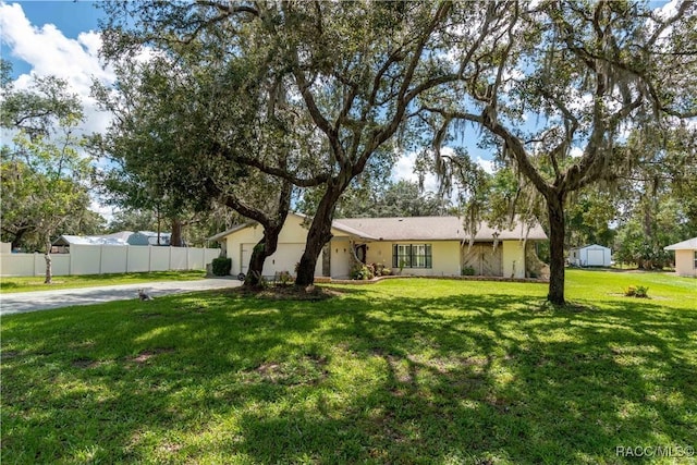 3231 S Eagle Pt, Inverness, FL 34450 - ranch-style home with concrete driveway and an attached garage