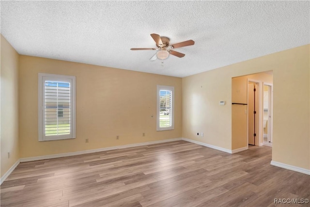 3231 S Eagle Pt, Inverness, FL 34450 - unfurnished room featuring a ceiling fan, light wood finished floors, and a textured ceiling