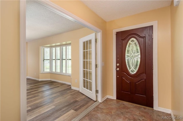 3231 S Eagle Pt, Inverness, FL 34450 - entryway with a textured ceiling and wood finished floors