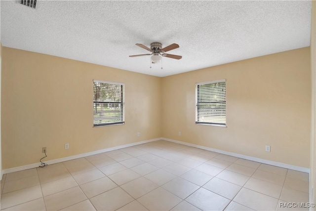 3231 S Eagle Pt, Inverness, FL 34450 - empty room with ceiling fan, a textured ceiling, and light tile patterned floors