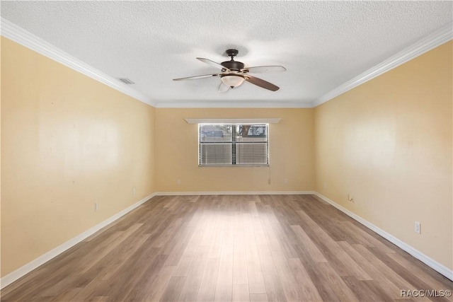 3231 S Eagle Pt, Inverness, FL 34450 - unfurnished room with a ceiling fan, wood finished floors, a textured ceiling, and ornamental molding