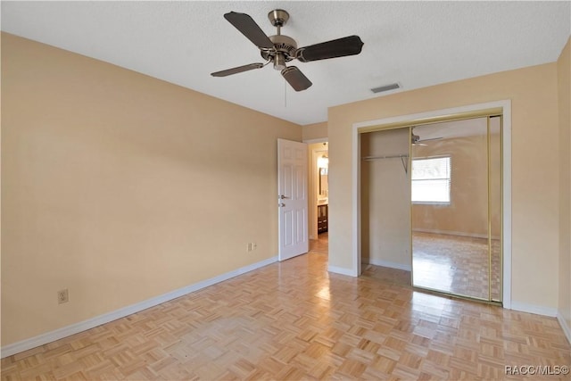 3231 S Eagle Pt, Inverness, FL 34450 - unfurnished bedroom featuring a closet, ceiling fan, and a textured ceiling