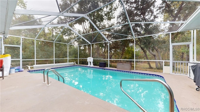 view of pool featuring a lanai and a patio area