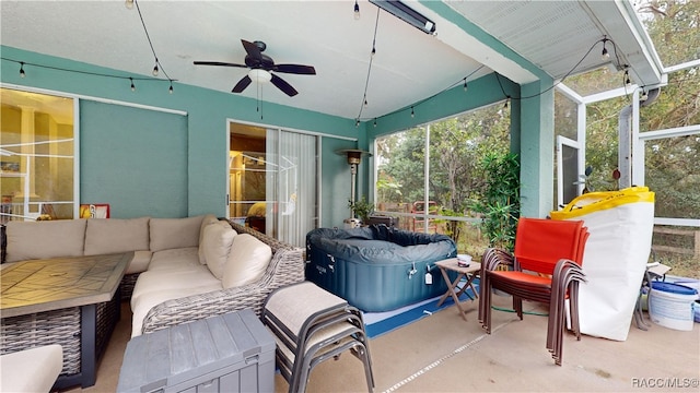 sunroom with ceiling fan