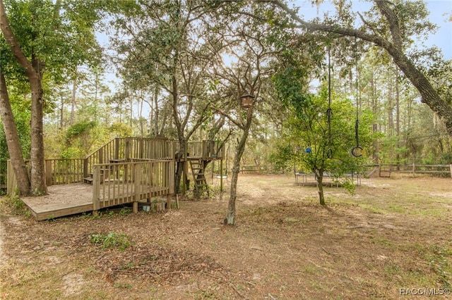 view of yard featuring a wooden deck