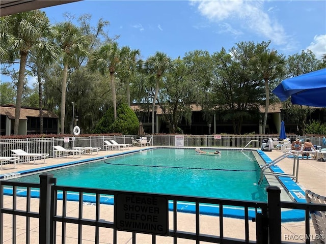 view of pool featuring a patio