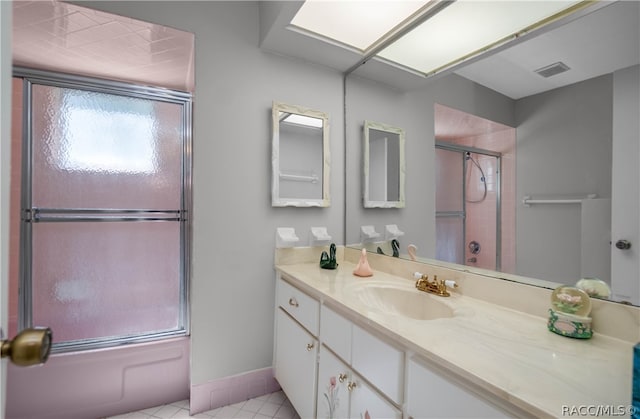 bathroom with tile patterned floors and vanity