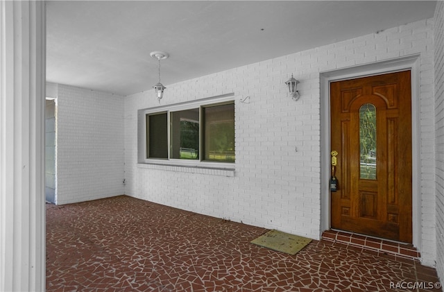 property entrance with covered porch