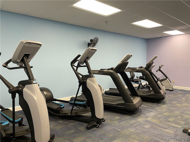 gym featuring carpet and a drop ceiling