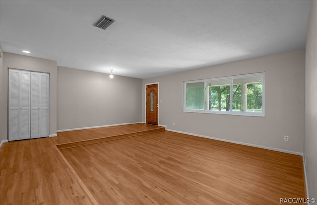 spare room featuring light hardwood / wood-style flooring