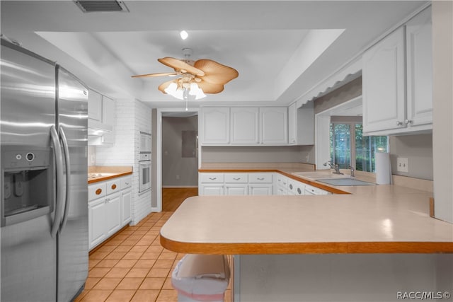 kitchen featuring white cabinets, ceiling fan, white appliances, and kitchen peninsula