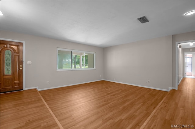 unfurnished living room with plenty of natural light and light wood-type flooring