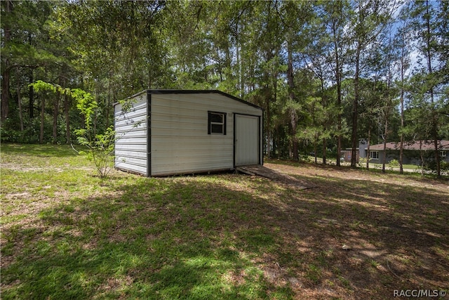 view of outdoor structure with a yard