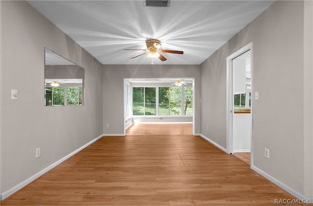 empty room with light wood-type flooring and a healthy amount of sunlight