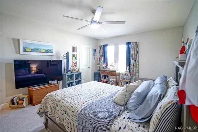 bedroom with a ceiling fan and carpet flooring