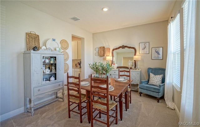 dining area featuring recessed lighting, visible vents, baseboards, and light colored carpet