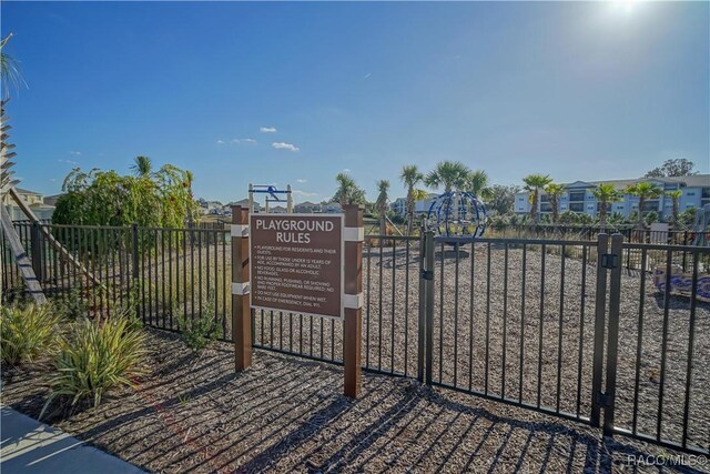 view of gate with fence