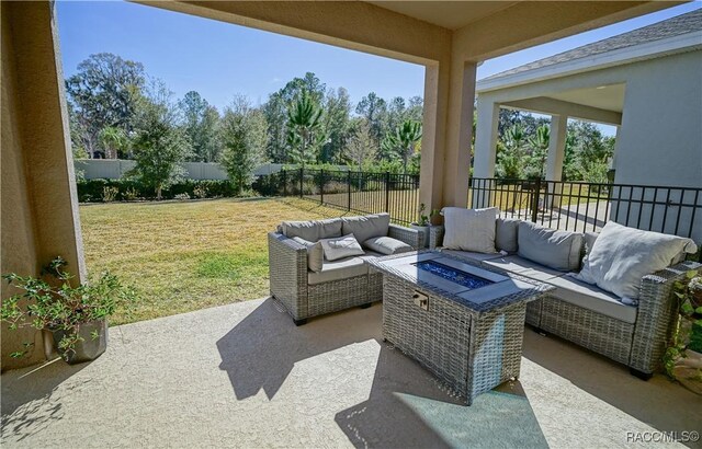 view of patio / terrace featuring an outdoor living space with a fire pit and a fenced backyard