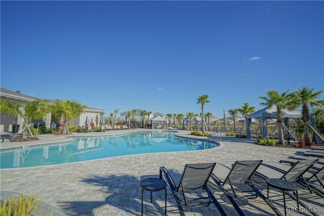 community pool with a patio