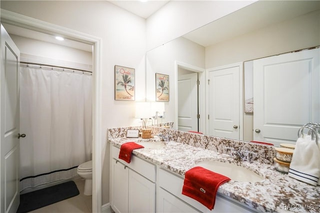 full bath featuring tile patterned floors, toilet, and vanity