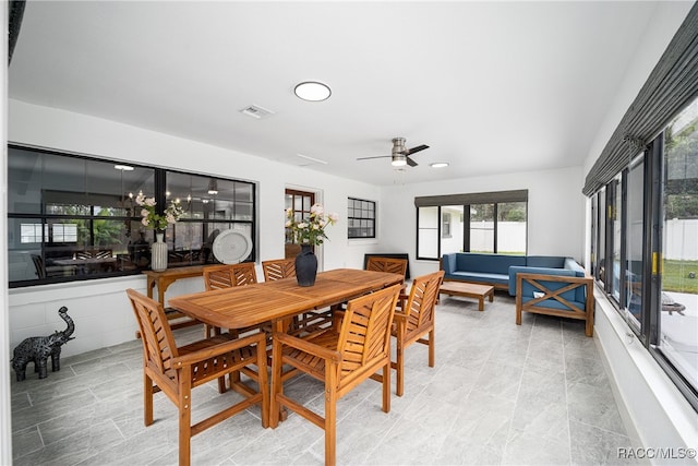 dining space with ceiling fan